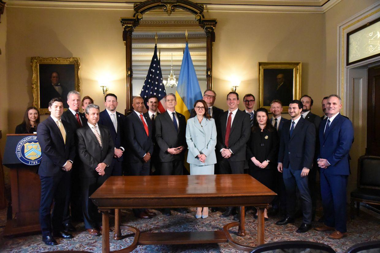 Ukrainian and U.S. officials attend the critical minerals agreement signing in Washington on April 30, 2025